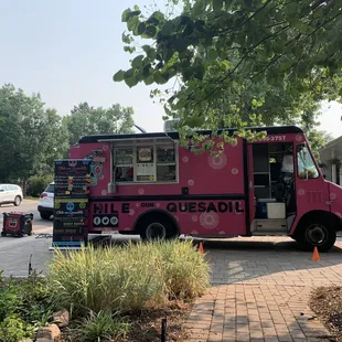 a food truck parked in front of a house