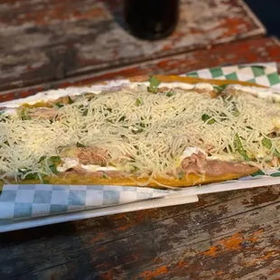 a pizza with cheese on top