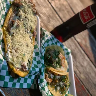 a plate of food and a bottle of beer