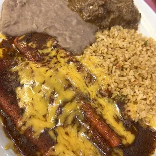 Enchiladas and carne gisada plate