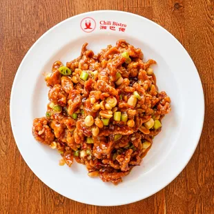 a plate of food on a wooden table