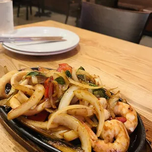 a plate of stir fried shrimp