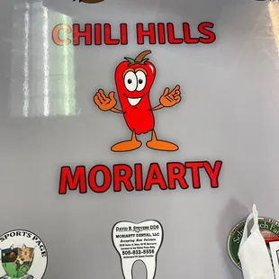 a refrigerator with stickers on it