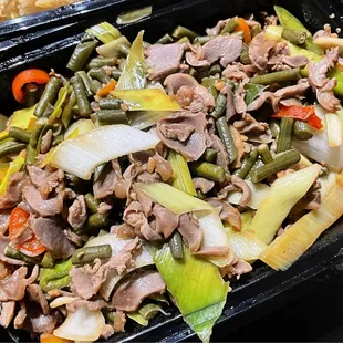 close up of a meal in a takeout container