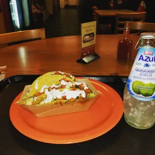 a plate of food and a bottle of water