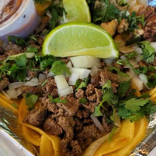 Streetbtacos, chicken, shredded beef, and carne asada