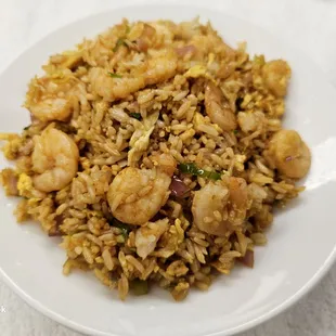 a plate of fried rice with shrimp