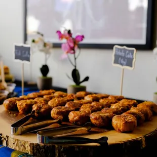 a variety of pastries on a wooden platter