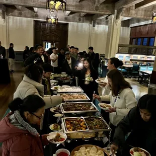 Guests making plates of ChiliCali's delicious Indonesian food!