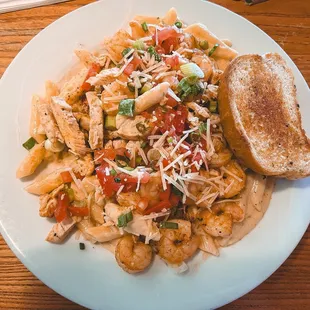 a plate of pasta with a toast