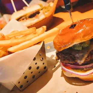 a hamburger and fries on a tray