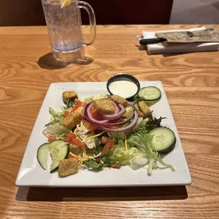 Side salad with ranch dressing.