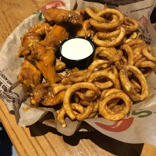 Buffalo chicken wings and curly fries