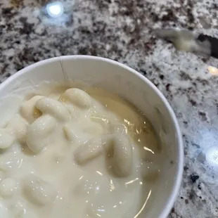 Queso watered down with curly noodles. GROSS.