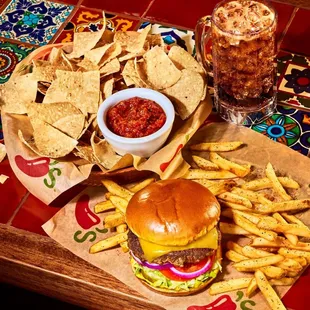 a cheeseburger and chips on a tray