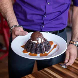 a man holding a plate of food