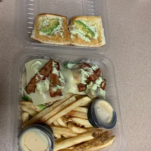 Chicken bacon avocado sandwich with frozen fries. The cooks bacon is cold, the cheese is slightly melted but cold, and the avocado is sad.