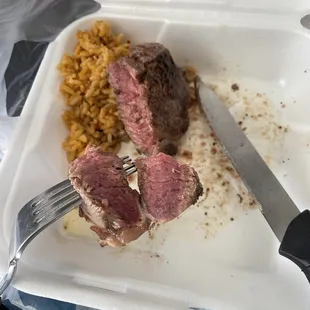 Raw steak leaked blood all over rice