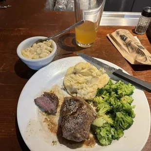 Mushy, broccoli, old potatoes, and a poor cut of meat. The steak was so salty.