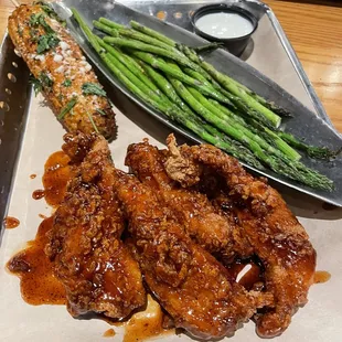 Honey Honey-Chipotle Chicken Crispers with asparagus and street corn. Great taste