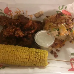 Honey chipotle chicken crispers, corn on the cob, and loaded mashed potatoes