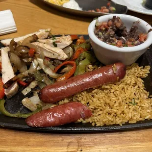 Chicken fajitas with jalapeño cheddar sausage and pico de gallo.