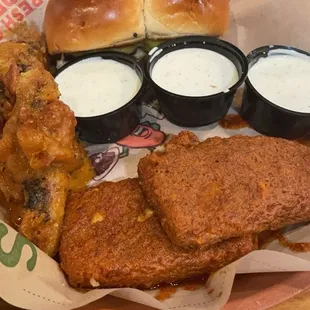 The triple sampler.. garlic parm wings, Nashville hot mozzarella sticks, and the sliders