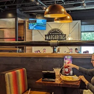 a woman eating at a restaurant