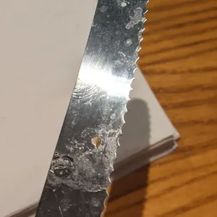 Knife pulled out of a paper sleeve