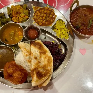 Special Thali: rice, parathas, papad, vada, buttermilk, sambar, rasam, beets, green beans, mixed vegetables, chickpeas, cabbage, lamb curry