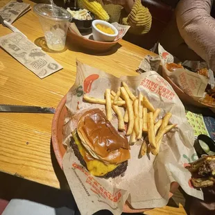 a burger and fries on a table