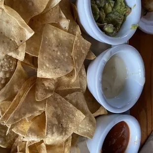 Dip Trio, queso yucky, brown guacamole
