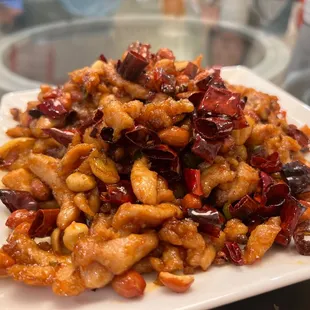 a plate of food on a glass table