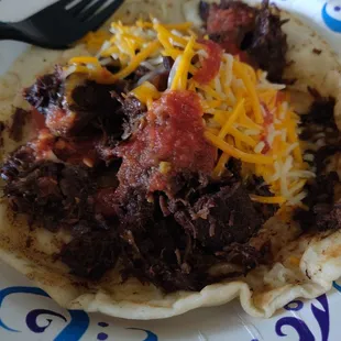 Barbacoa taco. Came home and added shredded cheese. So good and so much filling! More like a lunch item than breakfast lols
