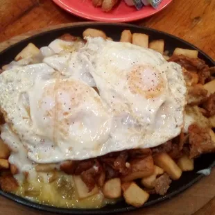 Country Fried Steak Skillet at Chilitos on Foothills. Home fries, two eggs, crispy fried steak cubes with creamy green Chile gravy.