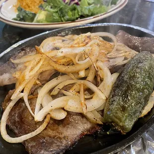 Steak with grilled onion and jalapeno