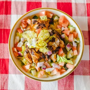 Greco Salad. Mediterranean style w/ cucumbers, tomatoes, red onion, kalamata olives, &amp; feta cheese served with balsamic viniagrette.