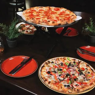 two pizzas on a table