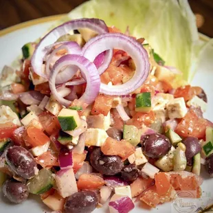 The Greco Salad. 
Mediterranean Style with Cucumbers, Tomatoes, Red Onion, Kalamata Olives and Feta Cheese Served with Balsamic Vinaigrette