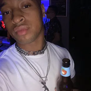 a man holding a beer