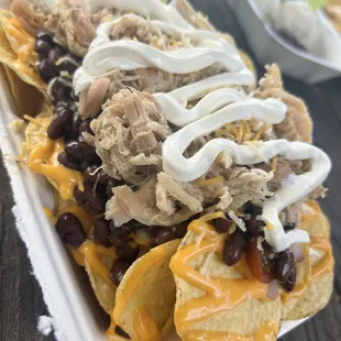 Chicken nachos, onions and tomatoes were hidden, couldn&apos;t find too many of them