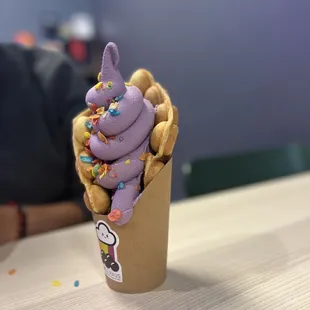 an ice cream cone with sprinkles