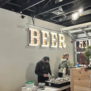 a man and woman preparing food