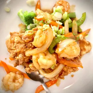 a plate of food with shrimp and vegetables