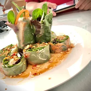 a plate of sushi rolls