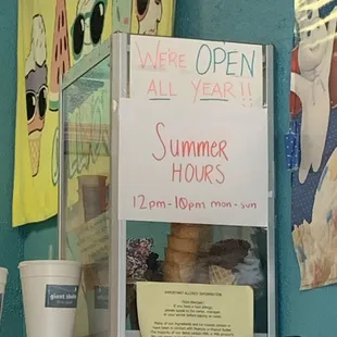 a sign for summer hours