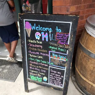 a chalkboard sign outside of a restaurant