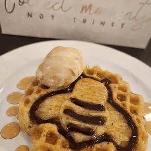 Gluten-free, vegan kids waffle with pure maple Syrup and a light chocolate sauce with dairy ice cream special.  Absolutely BEE-U-TIFUL