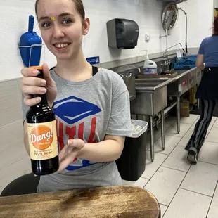 Kay selling the Dangs Butterscotch Rootbeer