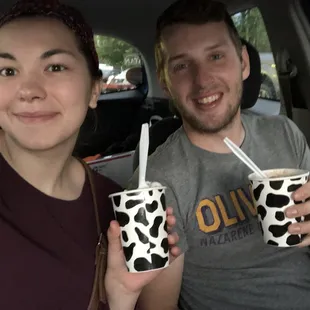 a man and a woman in a car